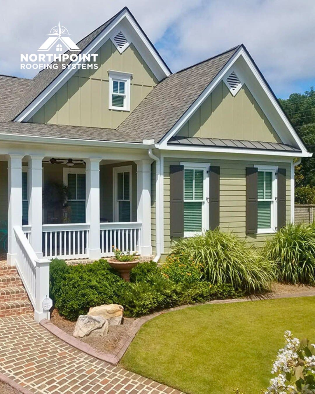 Northpoint Roofing Systems logo over a house with a new roof