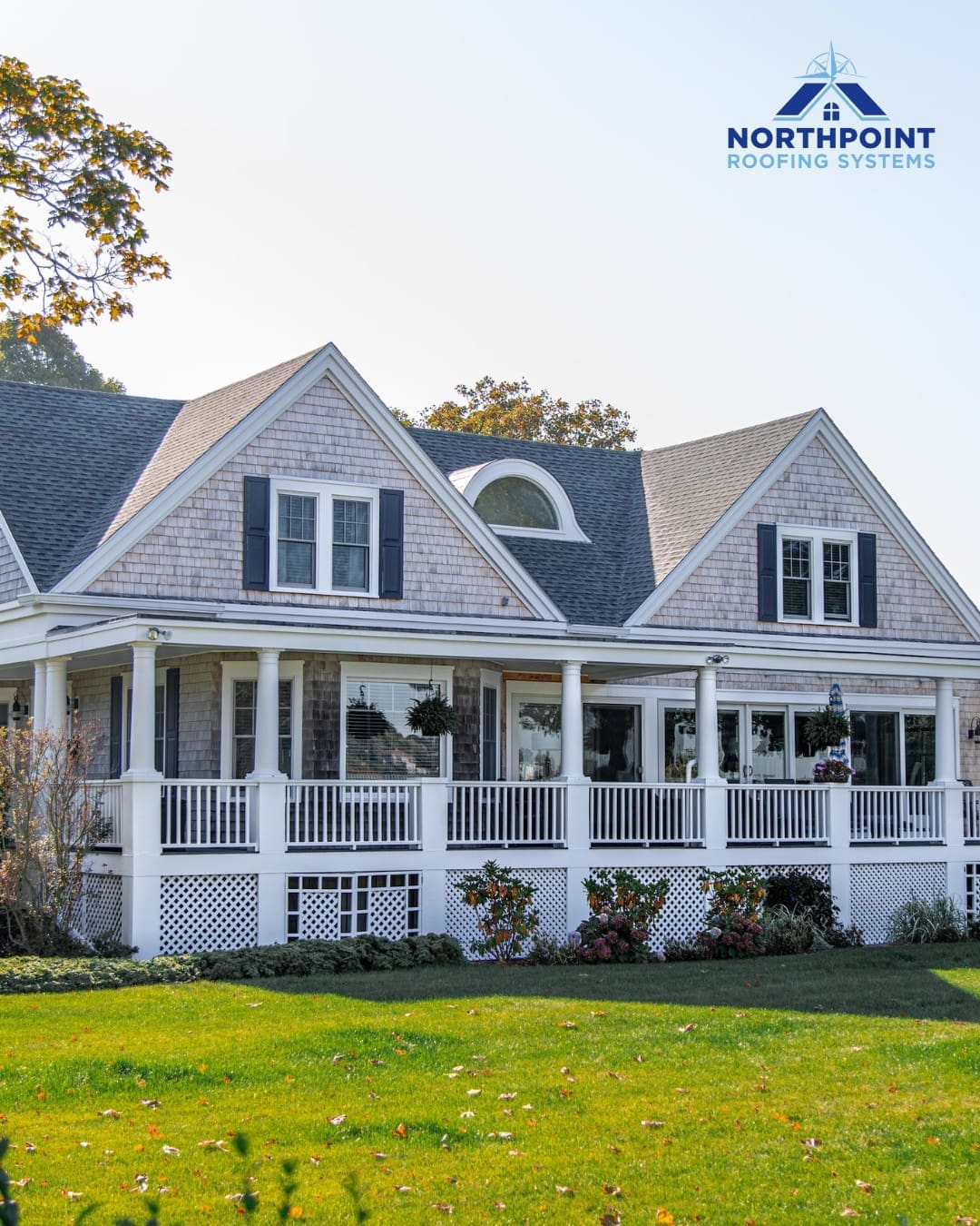 Northpoint Roofing Systems logo on a house with a new gray shingle roof